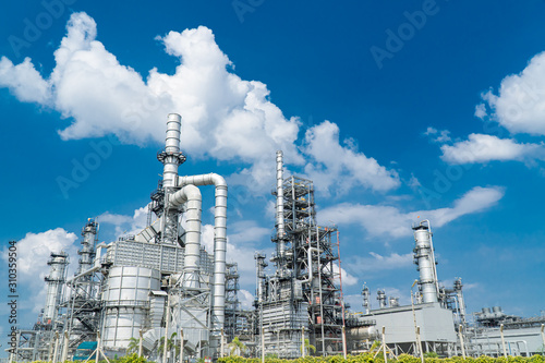 Oil and gas industrial,Oil refinery plant form industry,Refinery factory oil storage tank and pipeline steel blue sky background