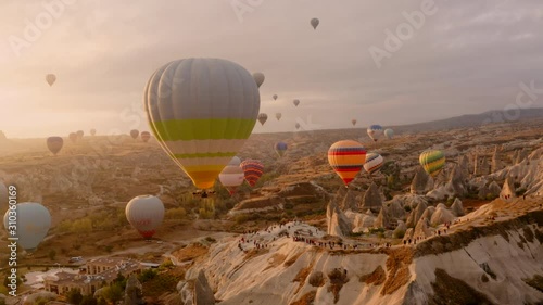 A balloon flies over Cappadocia, shooting from a drone in 4K