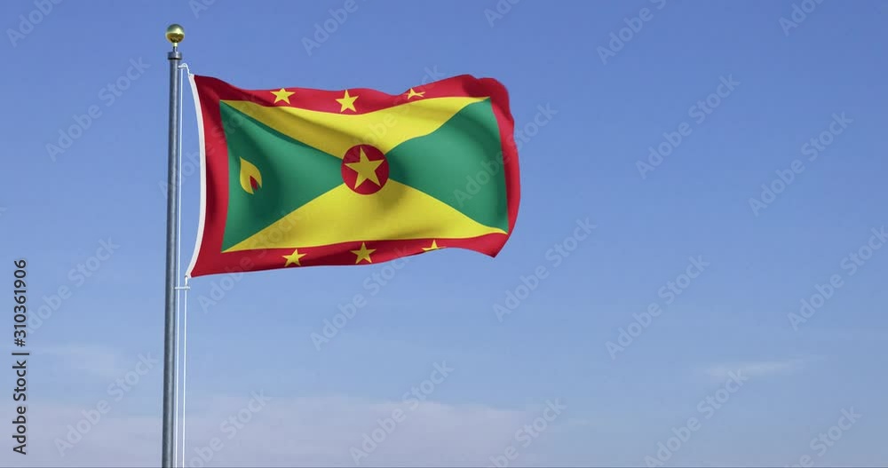 Grenada flag flying in blue sky