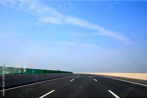 Beautiful highway, under the blue sky and white clouds © hanmaomin