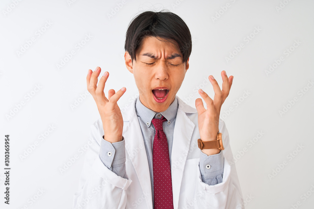 Chinese scientist man wearing tie and coat standing over isolated white background celebrating mad and crazy for success with arms raised and closed eyes screaming excited. Winner concept Chinese scientist man wearing tie and coat standing over isolated white background celebrating mad and crazy for success with arms raised and closed eyes screaming excited. Winner concept
