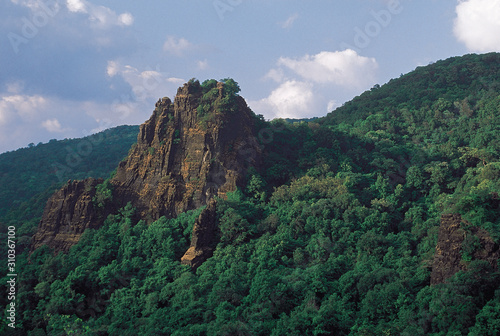 Sunlit Rock. The railway town was named after this basalt rock. Castle Rock, Karnataka, India.