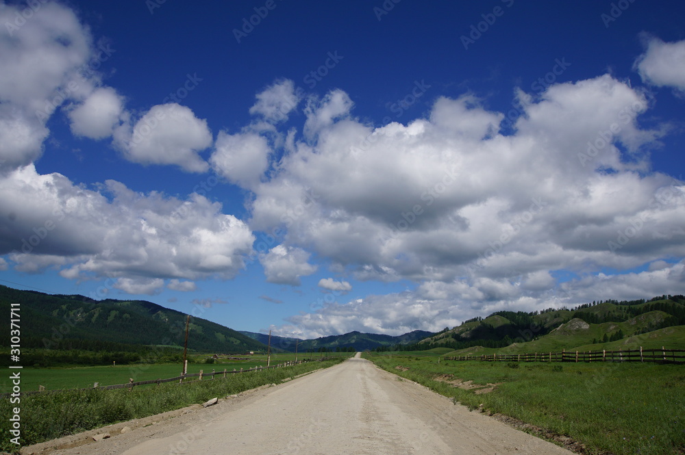 road, landscape, sky, highway, nature, travel, mountain, asphalt, blue, clouds, cloud, summer, rural, green, country, hill, field, horizon, tree, grass, way, empty, countryside, mountains, drive