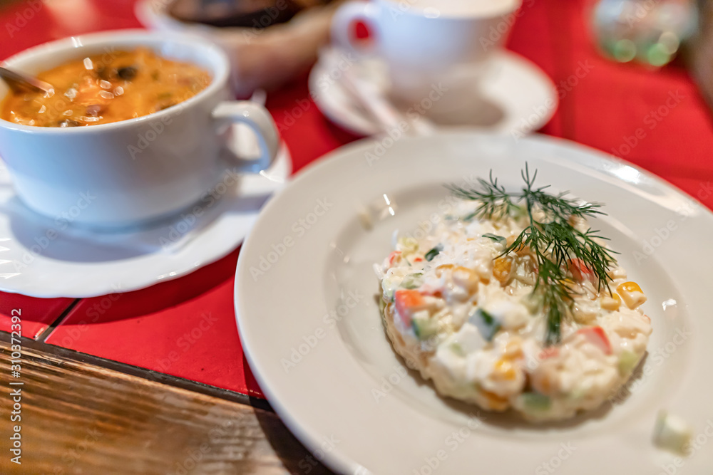 A small salad of crab sticks and eggs with mayonnaise A small salad of crab sticks and eggs with mayonnaise