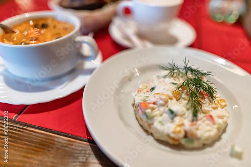 A small salad of crab sticks and eggs with mayonnaise