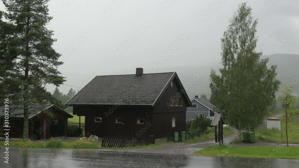 nordic heavy rain, village near oslo, norway nordic heavy rain, village near oslo, norway