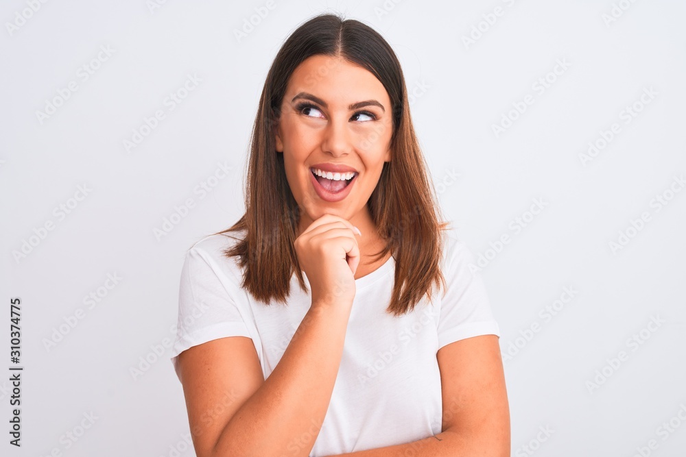 Portrait of beautiful and young brunette woman standing over isolated white background looking confident at the camera smiling with crossed arms and hand raised on chin. Thinking positive. Portrait of beautiful and young brunette woman standing over isolated white background looking confident at the camera smiling with crossed arms and hand raised on chin. Thinking positive.