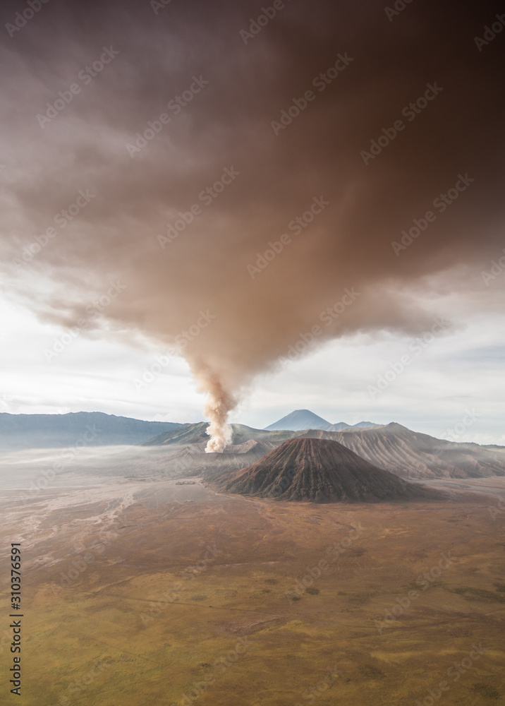The eruption of mount Bromo darken the surrounding sky.