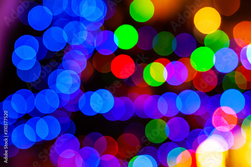 Colorful circles of light abstract background. Blurred defocused multi color lights
