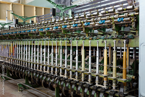 An old spinning machine at an abandoned textile factory