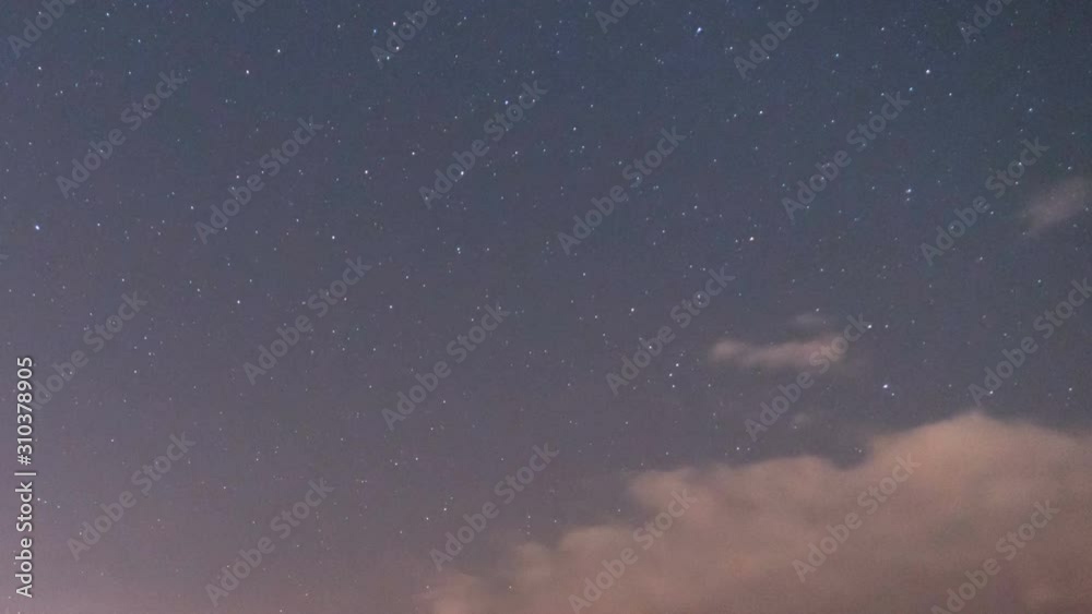 Stars, clouds moving at night timelapse on farm with slider Stars, clouds moving at night timelapse on farm with slider