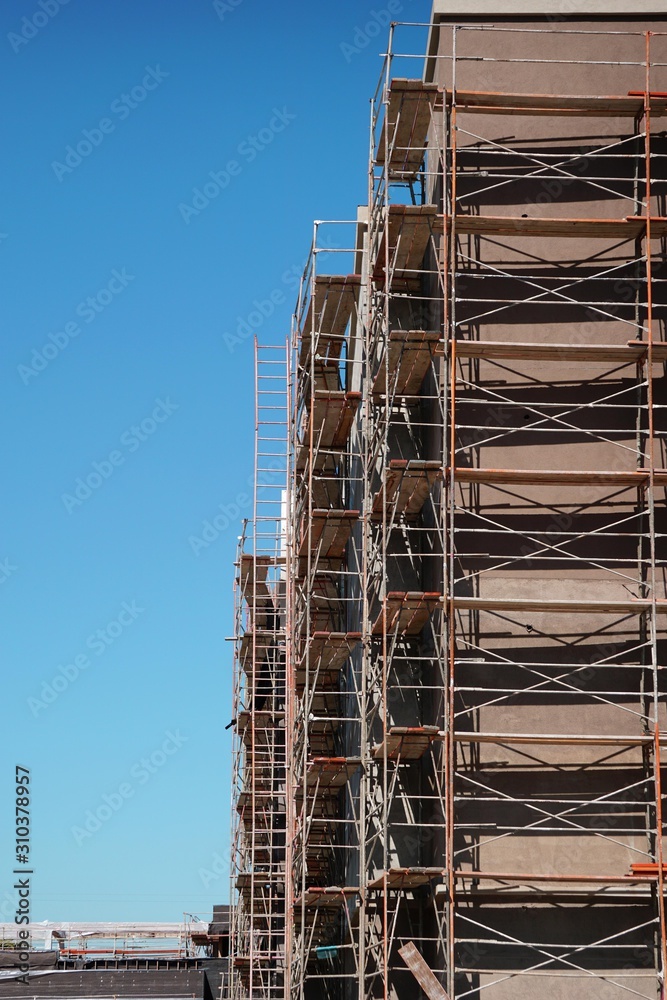Construction site with building and scaffold