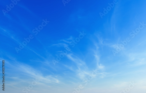 beautiful blue sky with soft white cloud background photo
