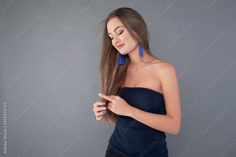 Woman with beauty long brown hair, posing at studio. Woman with beauty long brown hair, posing at studio.