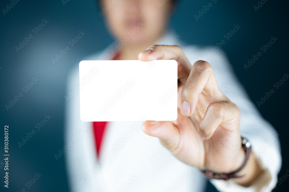 Hand holding a blank piece of paper. Close up white business card. Hand holding a blank piece of paper. Close up white business card.