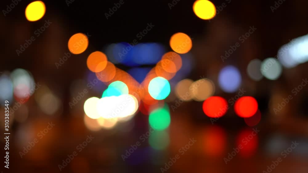 Blurred bokeh traffic on the road at night in a big city. Blurred bokeh traffic on the road at night in a big city.
