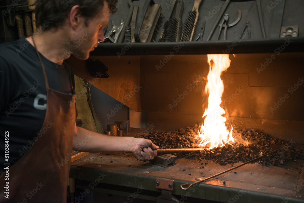 Man working in black smithery