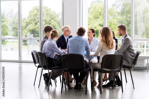 business, people and corporate concept - business team meeting at office