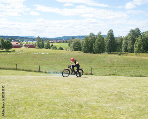 Woman on motorbike photo