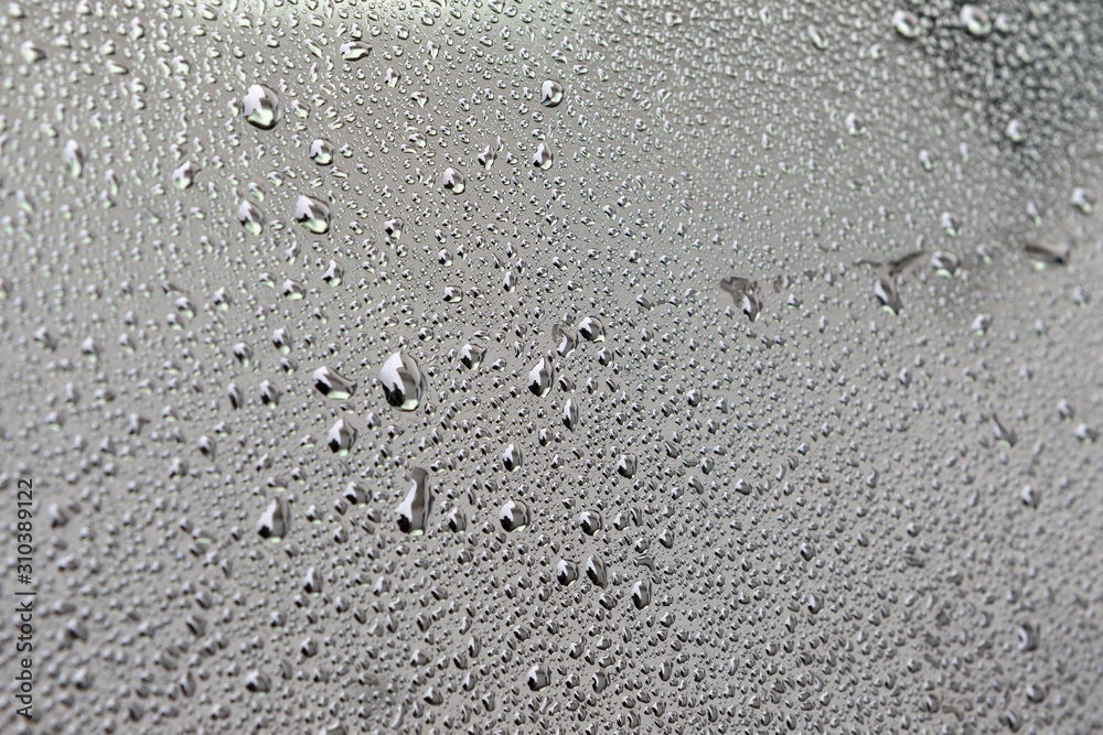 Grey surface with drops of rain water Grey surface with drops of rain water
