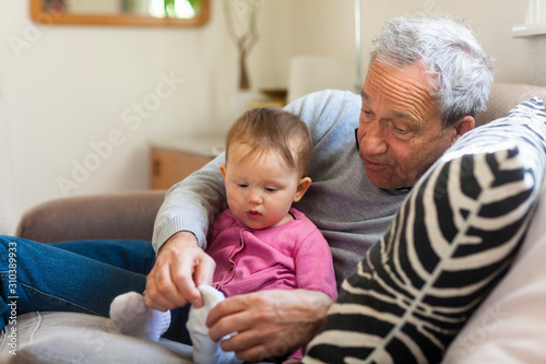 Baby girl with grandfather photo