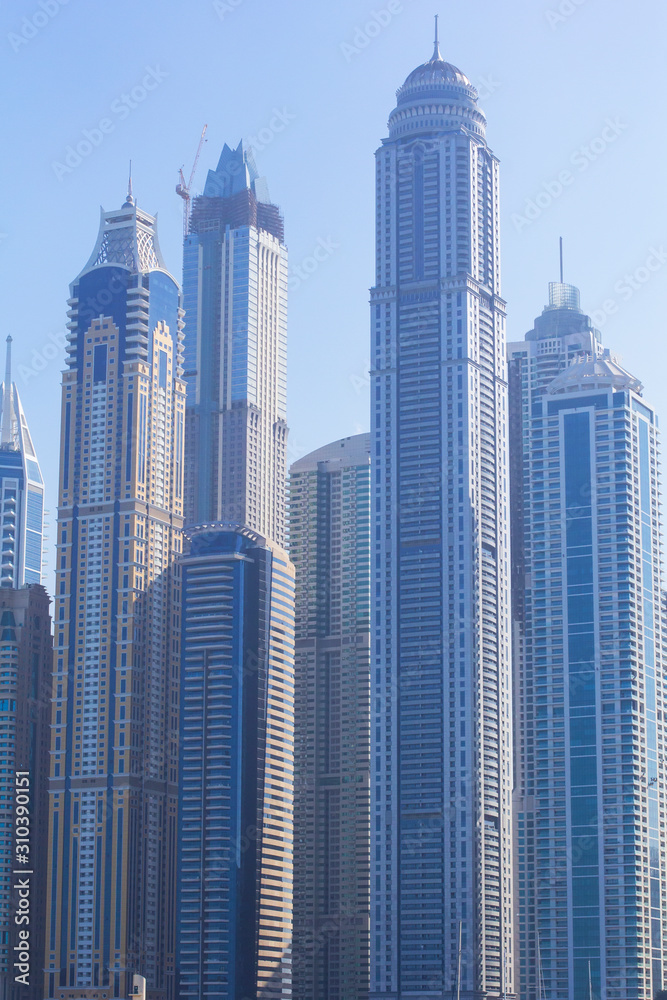 Fototapeta premium background, cityscape, view of the towers of the Dubai Marina area, in Dubai, United Arab Emirates