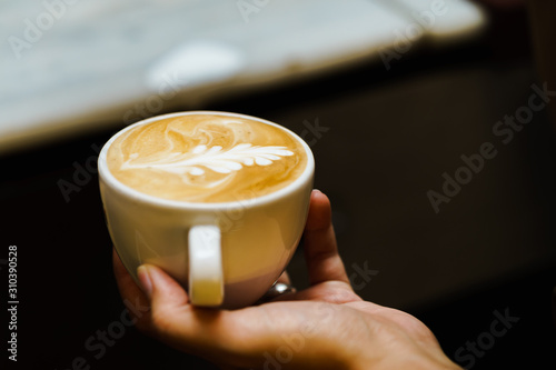 A cup of cappuccino or coffe latte