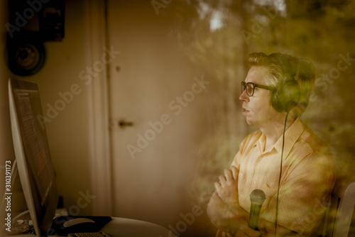 Man looking at computer screen photo