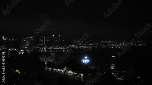 Coastal city at night creating a beautiful picturesque panorama view of the port and the sea in Baku Azerbeijan. photo