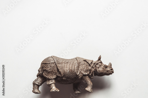 A toy rhino isolated against a white background