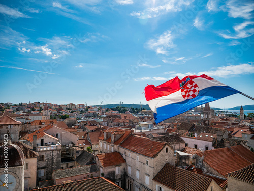 Croatian flag waving from the steeple of the Church of St. Dominic in Trogir, Croatia