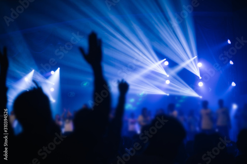 soft focus of Christian worship with raised hand,music concert