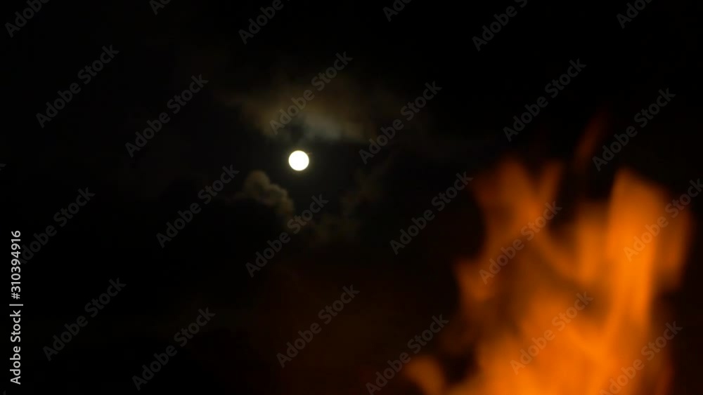 full moon reveal from middle of bonfire full moon reveal from middle of bonfire