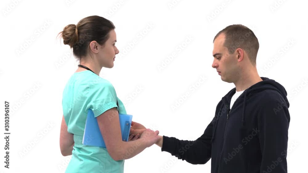 Close-up of doctor checking radial pulse on her male patient wrist. Professional medical check-up. Healthcare concept Close-up of doctor checking radial pulse on her male patient wrist. Professional medical check-up. Healthcare concept