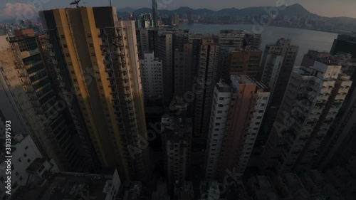 A motion time-lapse shot of Hong Kong apartment buildings area with day to night transition