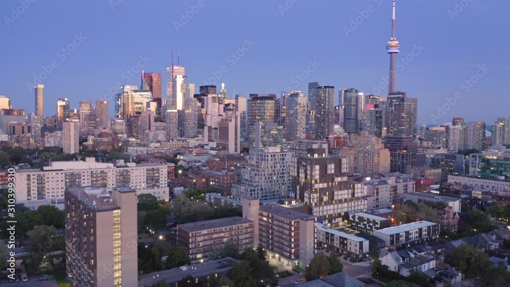 Aerial: Establishing shot of apartments & downtown Toronto city skyline at night. Ontario, Canada. Aerial: Establishing shot of apartments & downtown Toronto city skyline at night. Ontario, Canada.