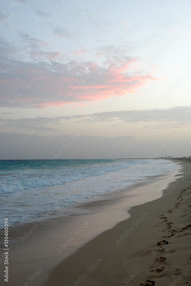 view of a secluded tropical beach in Cape Verde at sunset