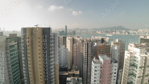 A motion time-lapse shot of Hong Kong apartment buildings area with day to night transition