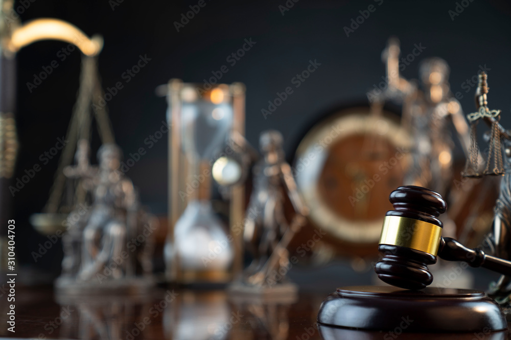 Law theme. Gavel of the judge, Themis statue and scale of justice on gray background. Law theme. Gavel of the judge, Themis statue and scale of justice on gray background.