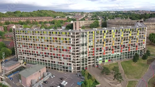 Aerial panning shot of a colorful apartment block. photo