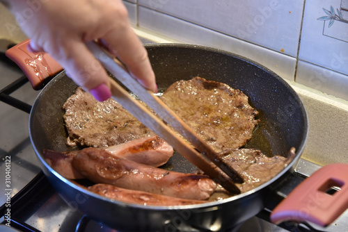 Cooking Sausage and Meat in the Cooking Pan