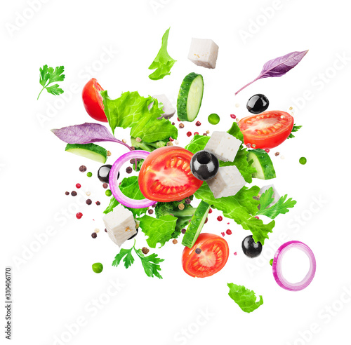 Salad ingredients are flying isolated on a white background. Healthy nutrition