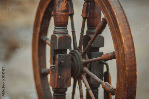 Old vintage antique peasant retro spinning wheel for weaving craft thread making