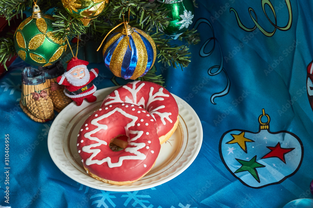 Christmas table decoration with a cake and toy Santa   