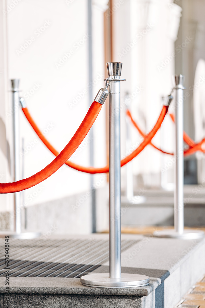 Fototapeta premium Posts for fencing the passage with a rope. Posts near the club, hotel, office building.