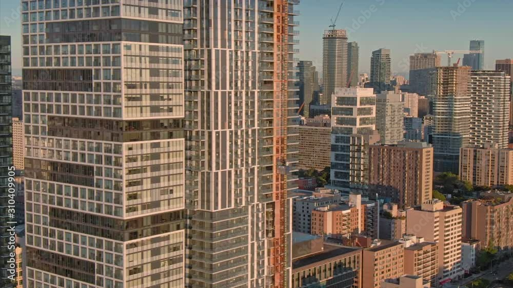 Aerial: Establishing shot of the skyscrapers of downtown Toronto city skyline at sunrise. Ontario, Canada. Aerial: Establishing shot of the skyscrapers of downtown Toronto city skyline at sunrise. Ontario, Canada.