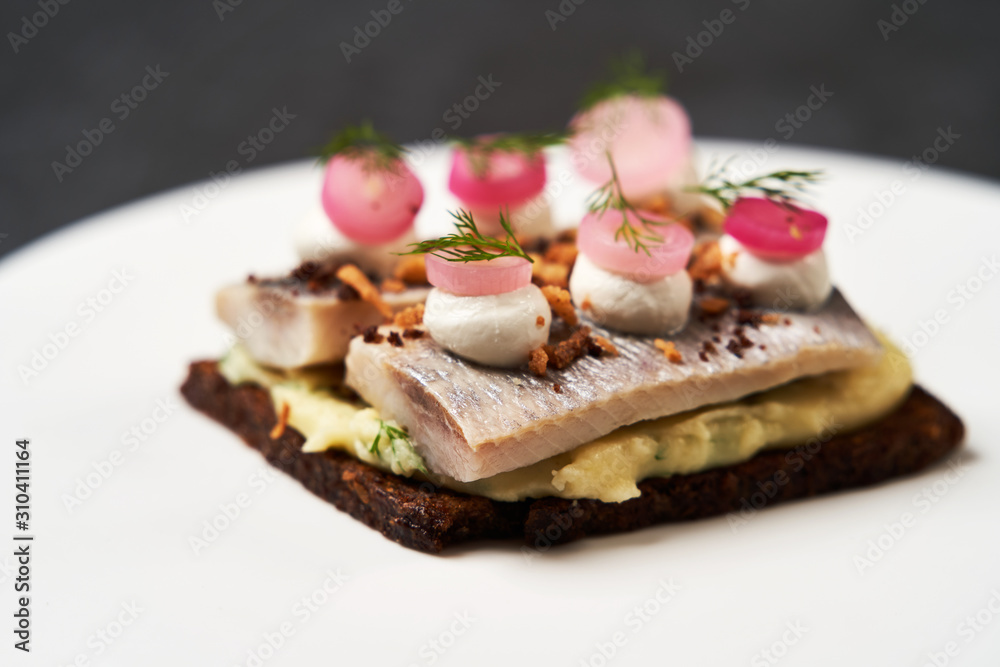 Smorrebrod with Baltic herring fish, smoked mousse and pickled onions Smorrebrod with Baltic herring fish, smoked mousse and pickled onions