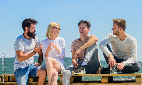 Family bonding time. diverse young people talking together. Group of people in casual wear. group of four people. great fit for day off. happy men and girl relax. best friends. Summer vacation