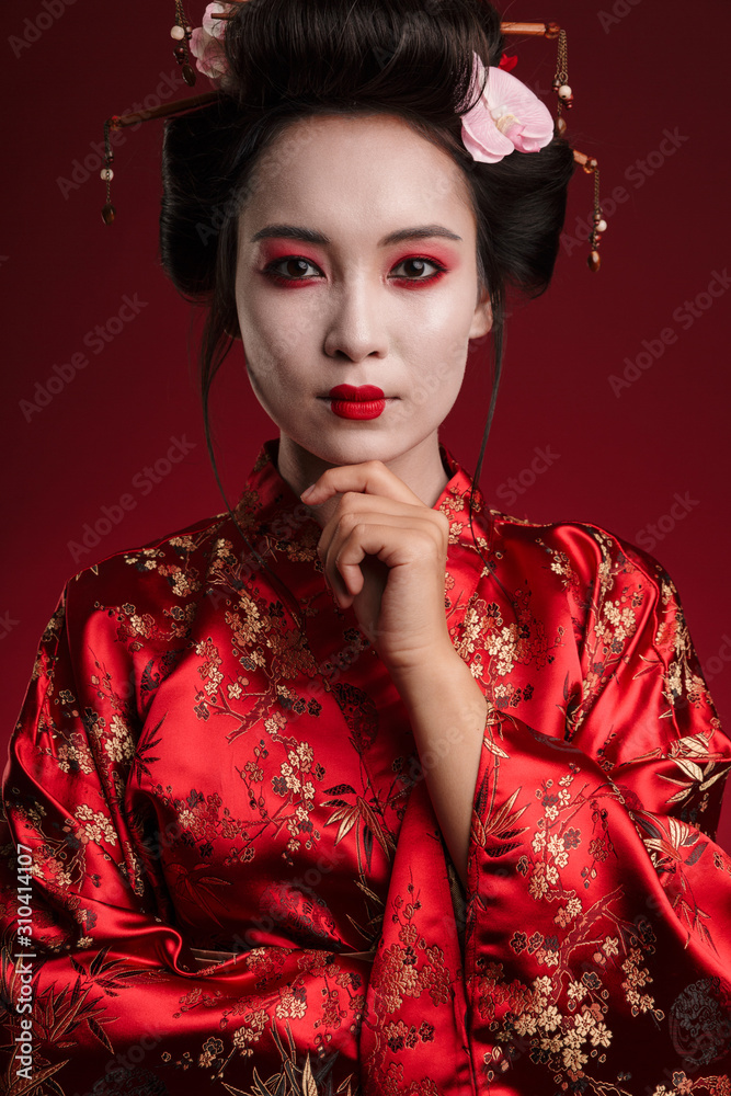 Φωτογραφία Image of young geisha woman in japanese kimono touching her chin