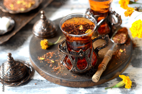 Turkish traditional tea on a white wooden background